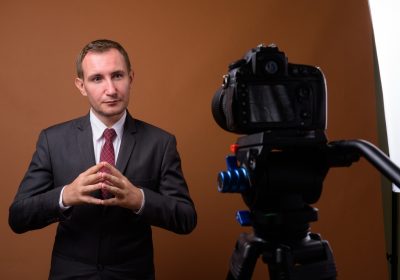 Studio shot of businessman against brown background Studio shot of businessman against brown background